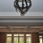 tray ceiling in foyer into coffered ceiling in great room